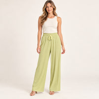 Modelo virtual creada con IA — pale lime ribbed wide-leg pull-on trousers with gathered elastic waistband, matching drawstring with silver tips