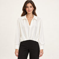 Modelo virtual creada con IA — white long sleeve collared deep V blouse with twisted front hem