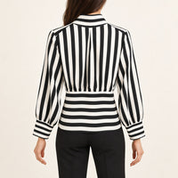 Modelo virtual creada con IA — BACK VIEW black white striped blouse with horizontal striped lower back panel